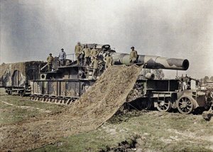 Eight French soldiers camouflaging a 370 mm railway gun with the inscription Keity, Noyon, Oise, France, September 5, 1917
